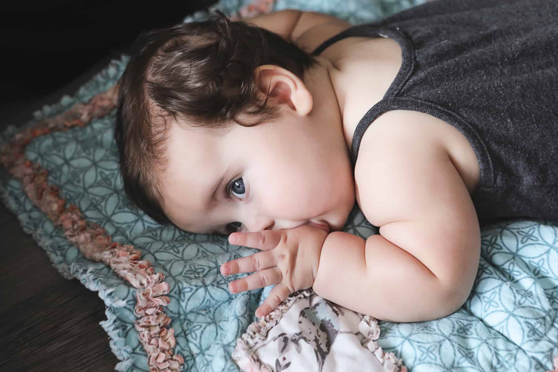 baby sleeping on tummy with face in mattress